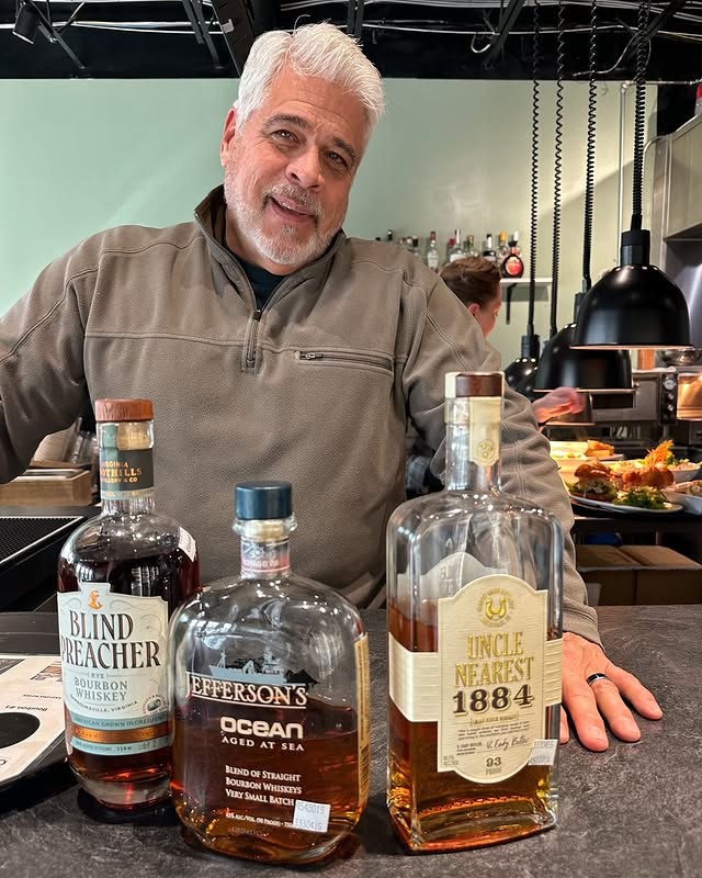 Man with whiskey bottles